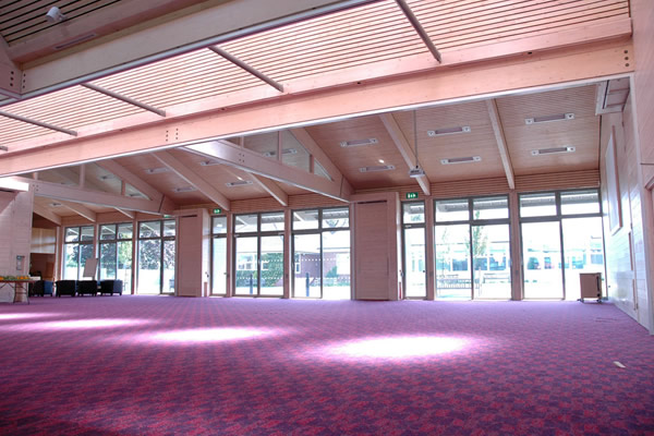 Conference hall with partitions open for meeting.